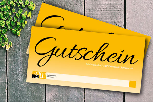 Bild vergrößern: Foto von zwei gelben Gutscheinen des Tourismusbüros.